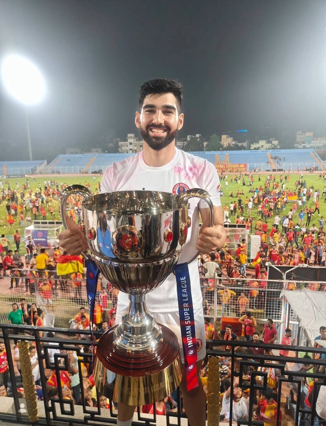 Zodiac Pro player celebrating with a trophy
